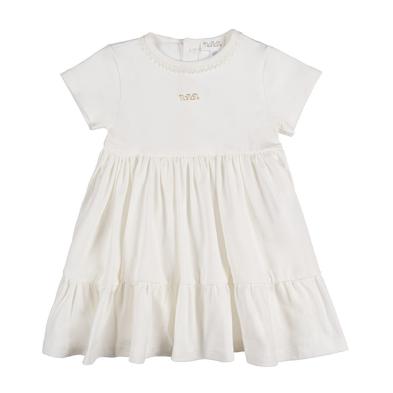 Abito off-white con passamaneria