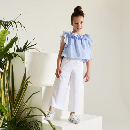 Blusa azzurra con frappe