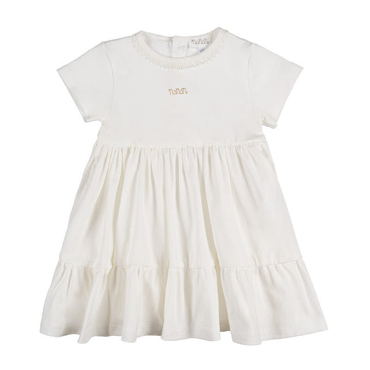 Abito off-white con passamaneria