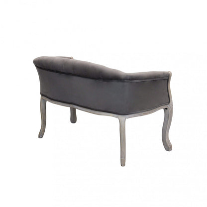 Divano elegante con capitonné in tessuto di lusso