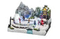 Christmas landscape with skaters and Santa Claus in motion with LED and music
