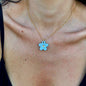 Daisy | Handcrafted light blue floral ceramic necklace with golden detail
