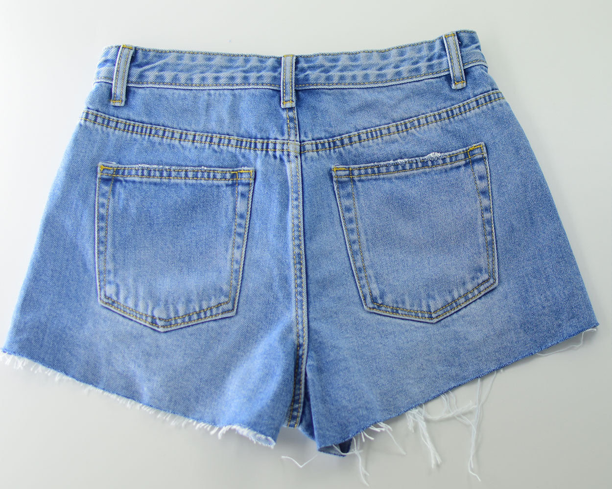 Pantaloncini di jeans strappati, super sottili  a vita alta