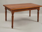 Extendable traditional-style table with turned legs, polished walnut finish